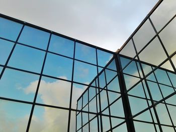 Low angle view of sky seen through glass window