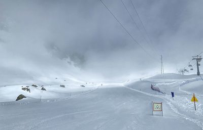 Scenic view of snow covered mountain against sky