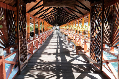 Perspective of wooden bridge with shadows