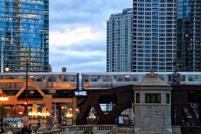 Buildings in city during sunset
