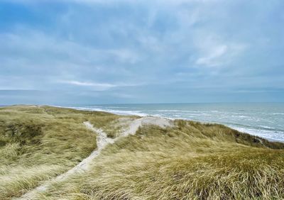 Scenic view of beach against sky
