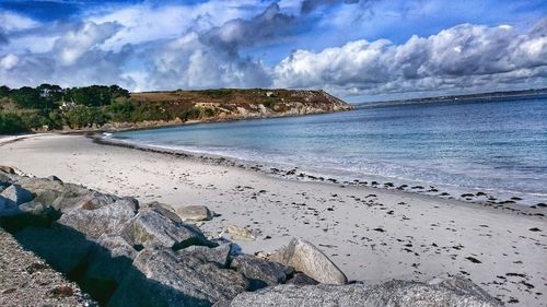 Scenic view of sea against cloudy sky