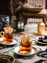 A glass of turkish tea on the table. conceptual stilllife photograhy with ramadan vibes concept
