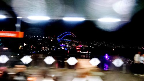 Blurred motion of illuminated ferris wheel