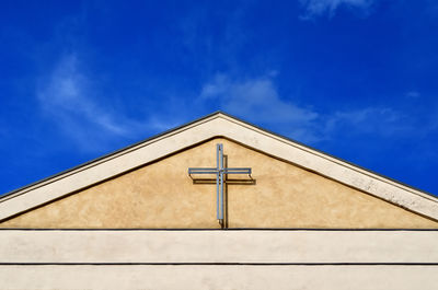 Low angle view of building against blue sky