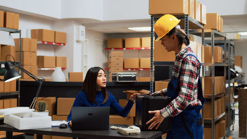 Side view of man working in office