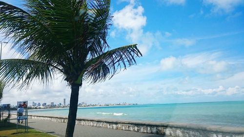 Scenic view of sea against cloudy sky