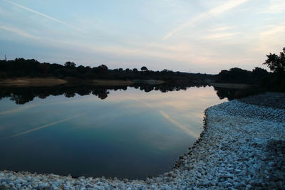 Reflection of trees in calm lake