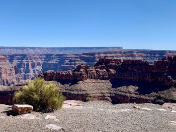 Panoramic view of rock formations against clear sky