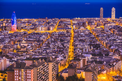 High angle view of city buildings at dusk