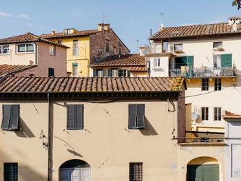 Buildings in city against clear sky