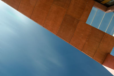 Low angle view of building against blue sky