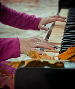 Cropped image of pianist playing piano