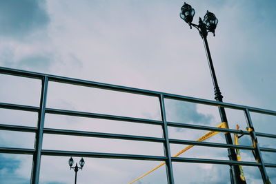 Low angle view of street light against sky