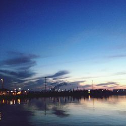 Scenic view of lake at sunset