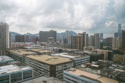 High angle view of buildings in city against sky