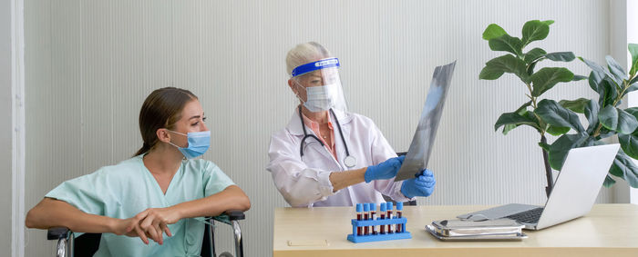 Women wearing mask and table at home