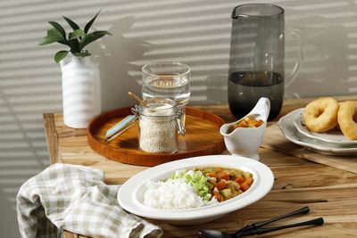 Breakfast with spicy chicken curry and rice with diced carrot and potato, japanese style.