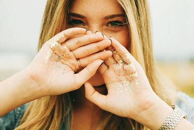 Close-up of woman holding hair