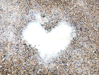 Close-up of heart shape on ground