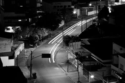 High angle view of city street and buildings at night