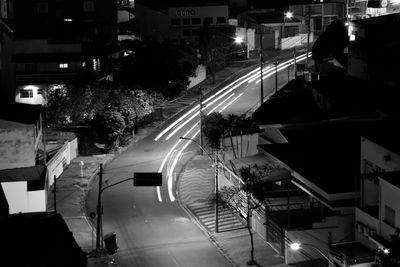 High angle view of city street and buildings at night