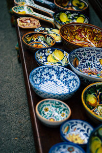 Close-up of antiques for sale at market stall