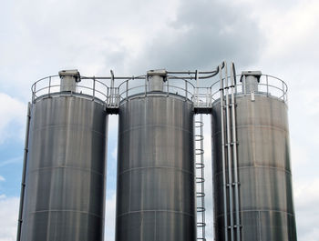 Low angle view of industrial building against sky