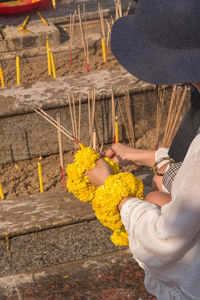 Close-up of woman holding flowers