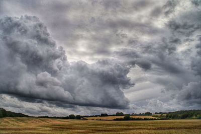 Scenic view of landscape against cloudy sky