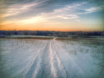 Scenic view of landscape against sky during sunset