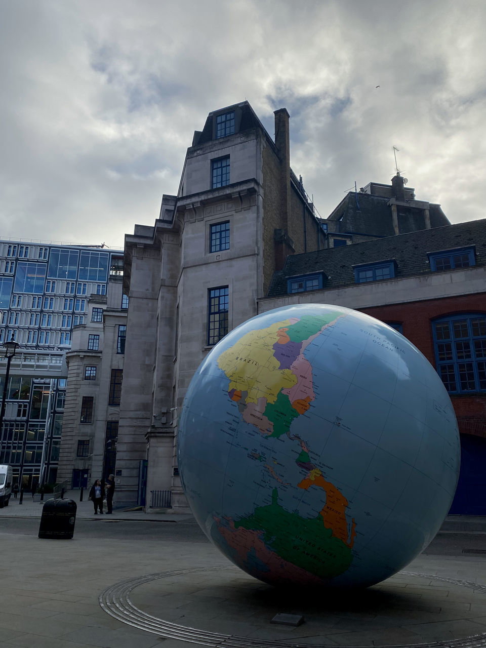 architecture, building exterior, globe - man made object, city, built structure, cloud, sky, nature, building, sphere, urban area, blue, planet earth, travel, travel destinations, planet, street, space, outdoors, no people, globe, map, world, business, environment, transportation