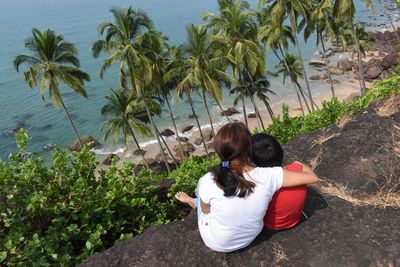 Rear view of women looking at sea