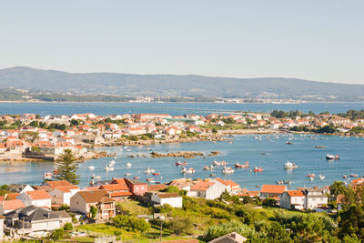 High angle view of townscape by sea