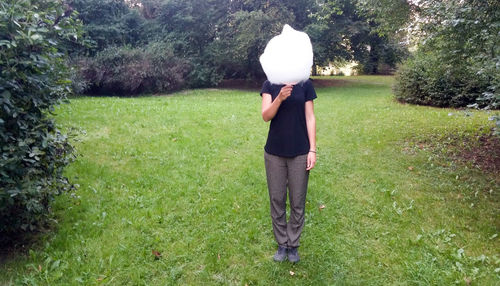 Rear view of woman standing in park