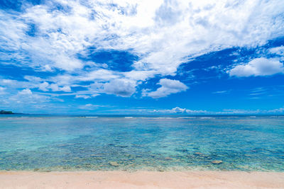 Scenic view of sea against blue sky