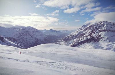 Scenic view of snowcapped mountains against sky. france, ski resort.