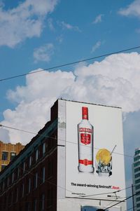 Information sign against sky