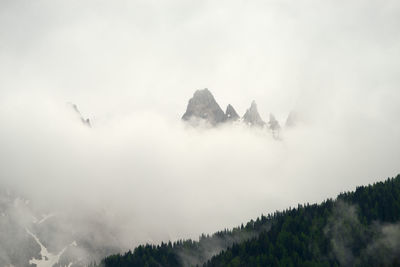 Scenic view of mountains against sky and fog