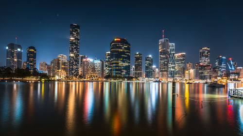 Illuminated buildings in city at night