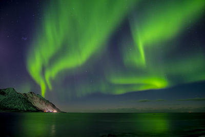 Scenic view of sea against sky at night