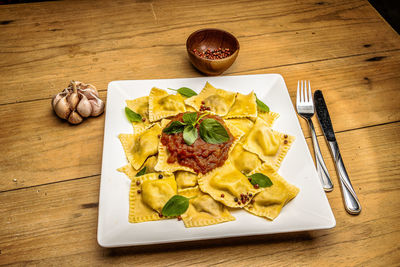 High angle view of italian pasta served on table