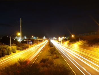 Light trails on railroad tracks at night