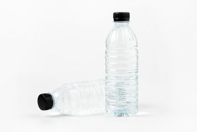 Close-up of glass bottle against white background