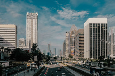 Panoramic view of buildings in city against sky