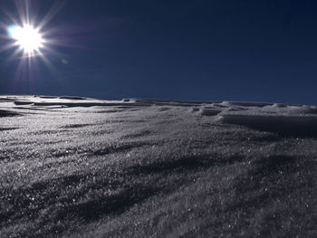 Scenic view of landscape against blue sky