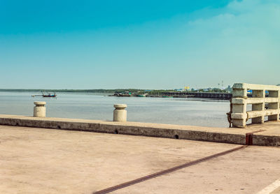 Scenic view of sea against clear blue sky