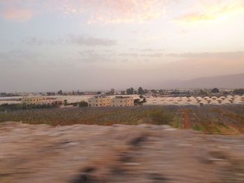 Scenic view of land against sky during sunset