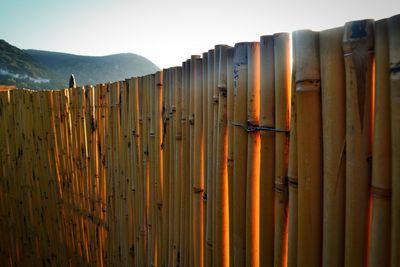 Wooden fence against sky