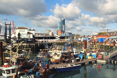 Boats moored at harbor